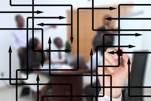 Image of meeting with diagram on glass wall