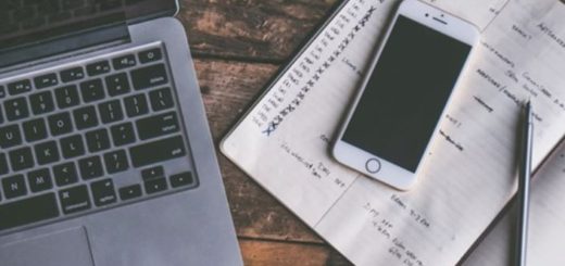 Photo of journal, phone and laptop