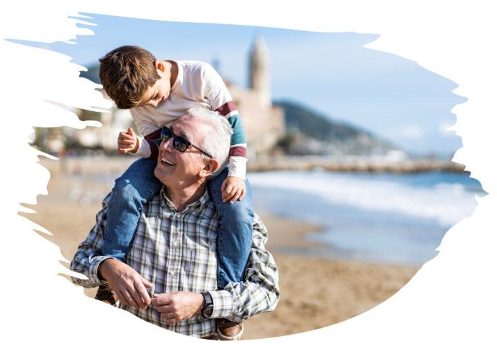 Image of boy on older man's shoulders