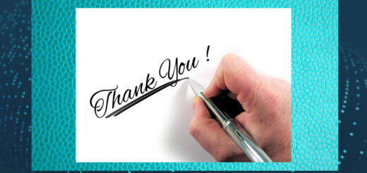 Image of person writing a handwritten thank you note